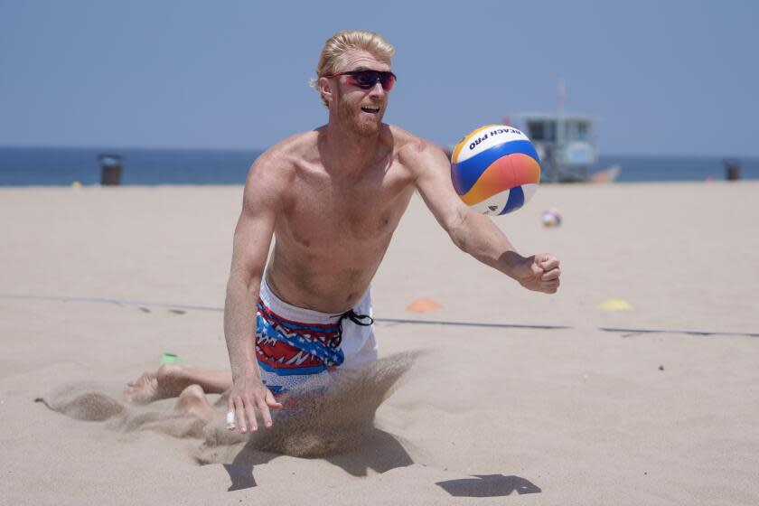 HERMOSA BEACH CA JUNE18, 2024 - Chase Budinger and beach volleyball partner Miles Evans.