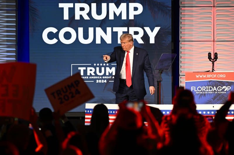 Former President Donald Trump waves to the crowd following his speech at the Florida Freedom Summit at the Gaylord Palms Resort in Kissimmee, Fla., earlier this month. On Friday, a Colorado district judge ruled Trump is eligible to be on the state's 2024 presidential primary ballot, rejecting claims the former president should be barred under a constitutional amendment that disqualifies candidates who've engaged in "insurrection or rebellion" against the United States. Photo by Joe Marino/UPI