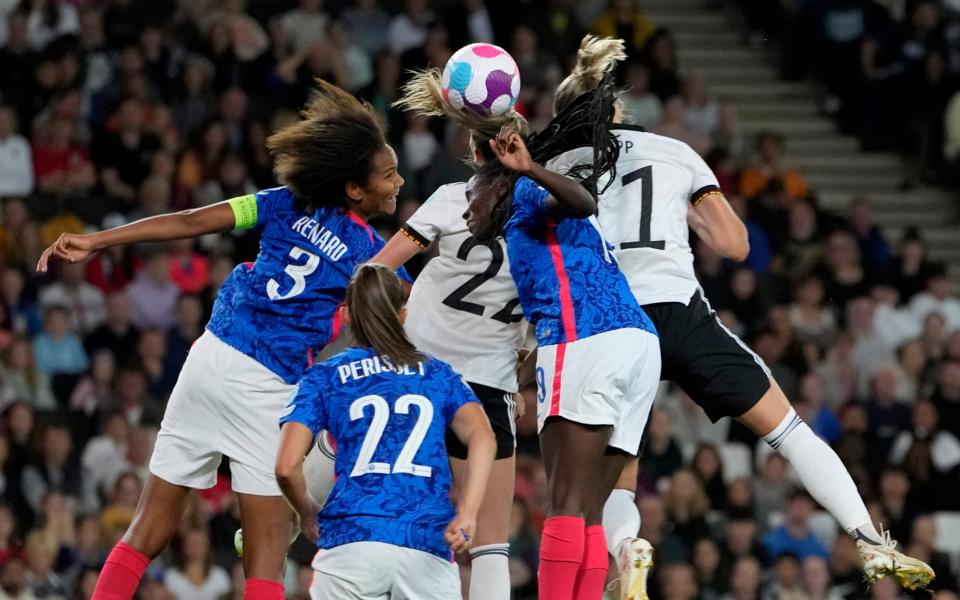 Germany's Alexandra Popp, right, scores her side's second goal during the Women Euro 2022 semifinal soccer match - AP