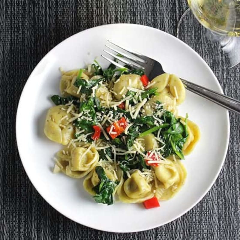 <p>Cooking Chat Food</p><p>This dinner pairs beautifully with a glass of white wine. Cheers to easy, breezy cooking!</p><p><strong>Get the recipe: <a href="https://cookingchatfood.com/quick-tortellini-with-spinach-garlic/" rel="nofollow noopener" target="_blank" data-ylk="slk:Quick Tortellini With Spinach;elm:context_link;itc:0;sec:content-canvas" class="link rapid-noclick-resp">Quick Tortellini With Spinach</a></strong></p>