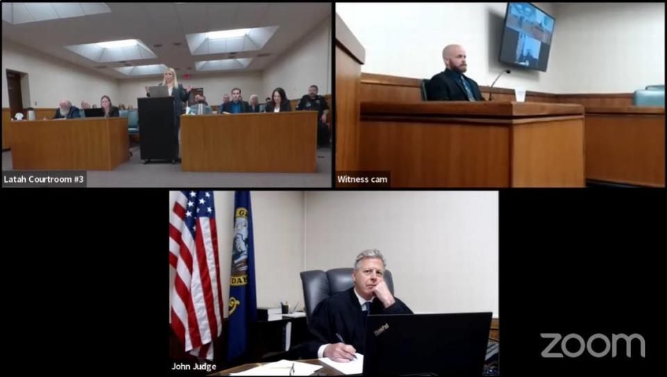 Judge John Judge, bottom, of Idaho’s 2nd Judicial District, listened in as Moscow police Cpl. Brett Payne, top right, answered questions from defense attorney Anne Taylor during a pretrial hearing for Moscow college student homicide suspect Bryan Kohberger, on Thursday, May 30, 2024, at the Latah County Courthouse in Moscow, Idaho.