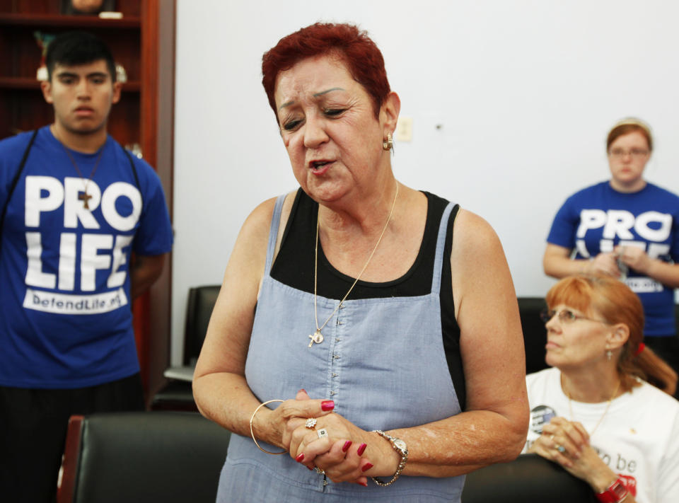 FILE - In this July 28, 2009 file photo, Norma McCorvey, right, the plaintiff in the landmark lawsuit Roe v. Wade, speaks up as she joins other anti-abortion demonstrators inside House Speaker Nancy Pelosi's office on Capitol Hill in Washington. McCorvey died at an assisted living center in Katy, Texas on Saturday, Feb. 18, 2017, said journalist Joshua Prager, who is working on a book about McCorvey and was with her and her family when she died. He said she died of heart failure. (AP Photo/Manuel Balce Ceneta)