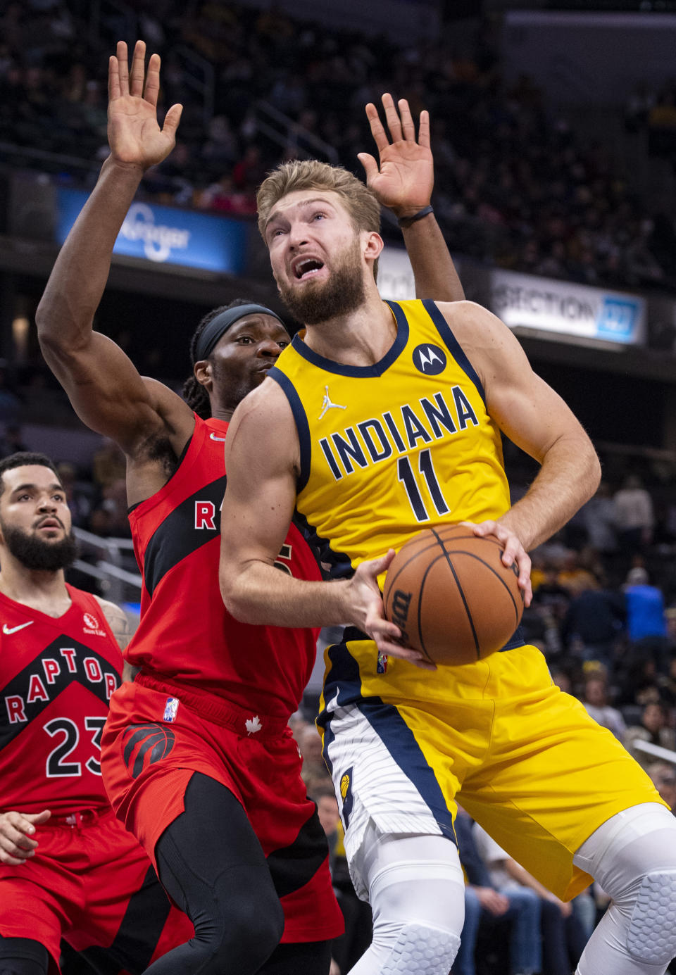 Indiana Pacers forward Domantas Sabonis (11) works the ball toward the basket during the second half of an NBA basketball game against the Toronto Raptors in Indianapolis, Friday, Nov. 26, 2021. (AP Photo/Doug McSchooler)