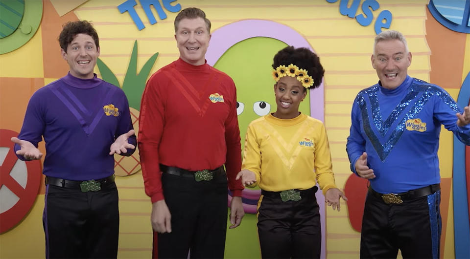 Purple, Red, Yellow, Blue Wiggles looking at the camera as they tell Steve Carell he can't join their group.