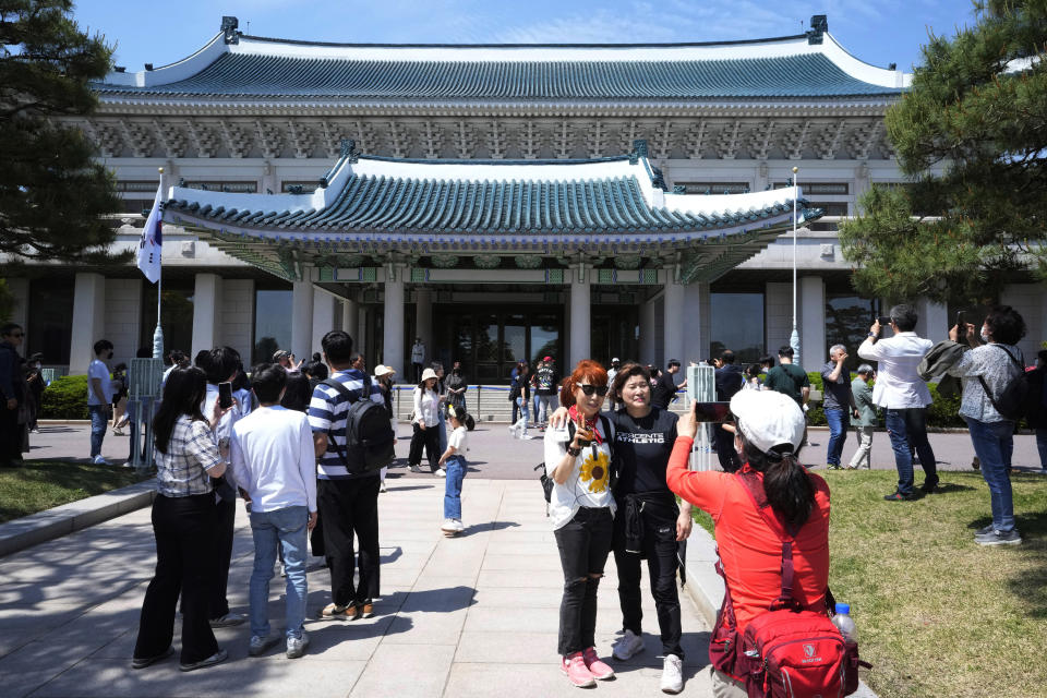 People visit the Blue House, the former presidential palace, in Seoul, South Korea, Tuesday, May 10, 2022. For most South Koreans, the former presidential palace in Seoul was as shrouded in mystery as the buildings in their secretive rival North Korea. That’s now changed recently as thousands have been allowed a look inside for the first time in 74 years.(AP Photo/Ahn Young-joon)