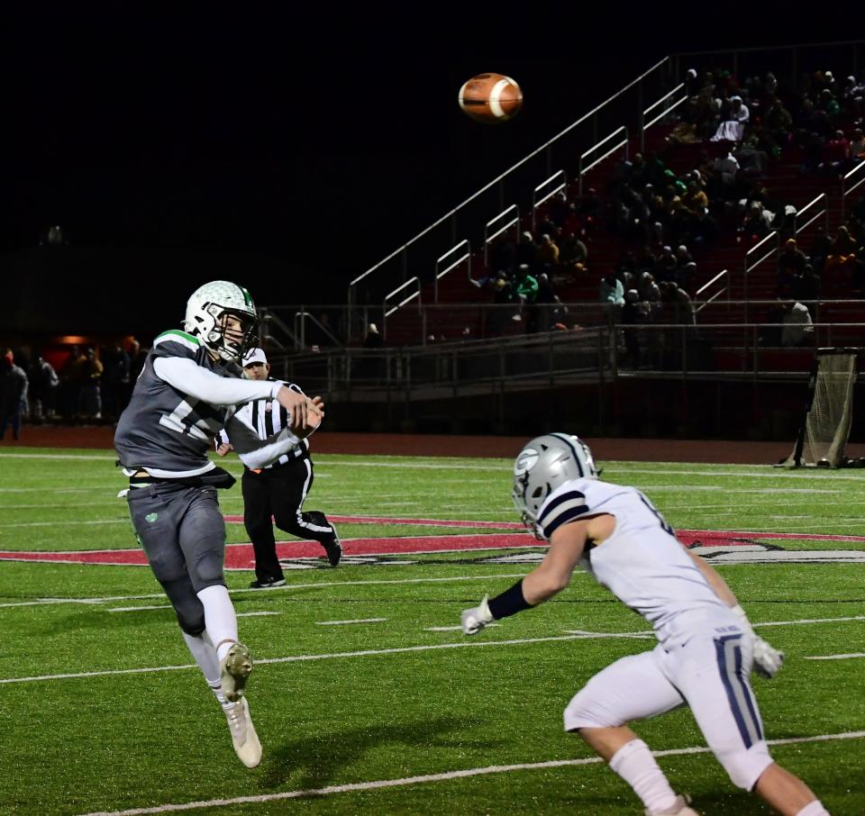 Badin quarterback Alex Ritzie fires off a pass for the Rams at the OHSAA Division III state football semifinals, Nov. 26, 2021.