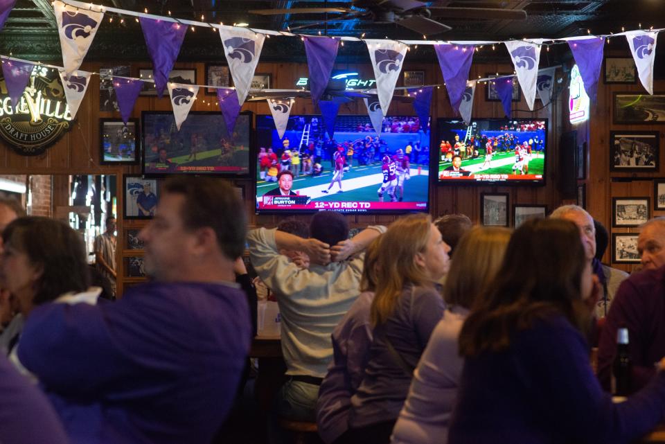 Silence fills the room after another Alabama touchdown in the second quarter of the Sugar Bowl in New Orleans. Kansas State football fans gathered at Kite's Bar and Grill in Manhattan on Saturday to cheer on their team.