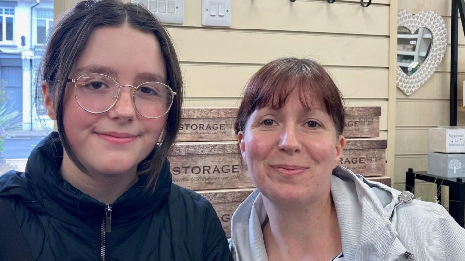 Mother and daughter shopping in garden centre