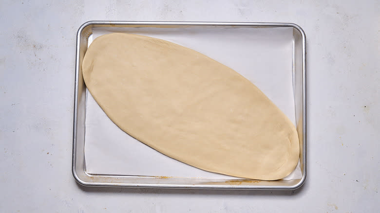 flatbread crust on baking sheet