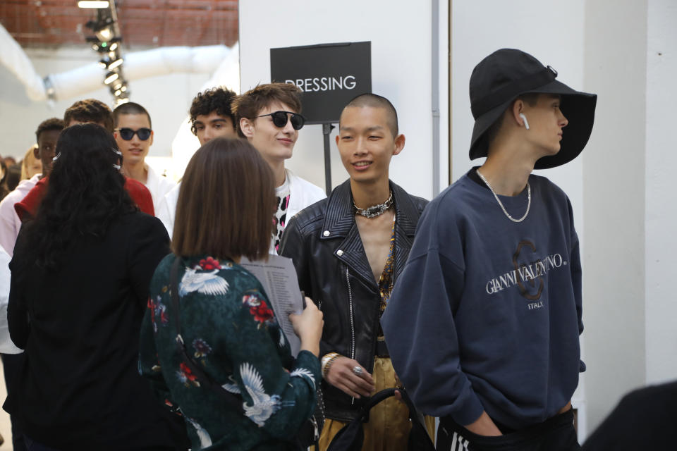 Models wait backstage prior to the Sacai mens Spring-Summer 2020 fashion collection presented in Paris, Saturday, June 22 2019. (AP Photo/Michel Euler)