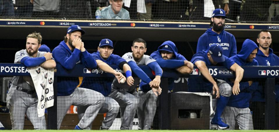 Dodgers players watch from the dugout during the ninth inning in Game 4 of the NLDS against the San Diego Padres.