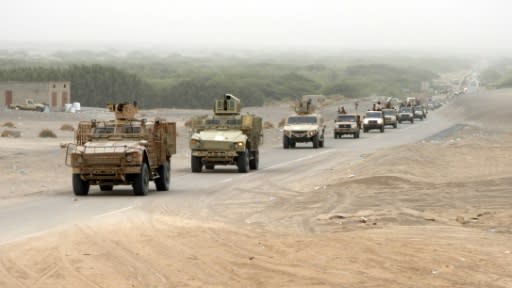 An armoured convoy of Yemeni pro-government fighters arrives in Al-Durayhimi district, south of Hodeida, on June 13, 2018, at the start of an Emirati-backed campaign to retake the strategic Red Sea port city from Huthi rebels