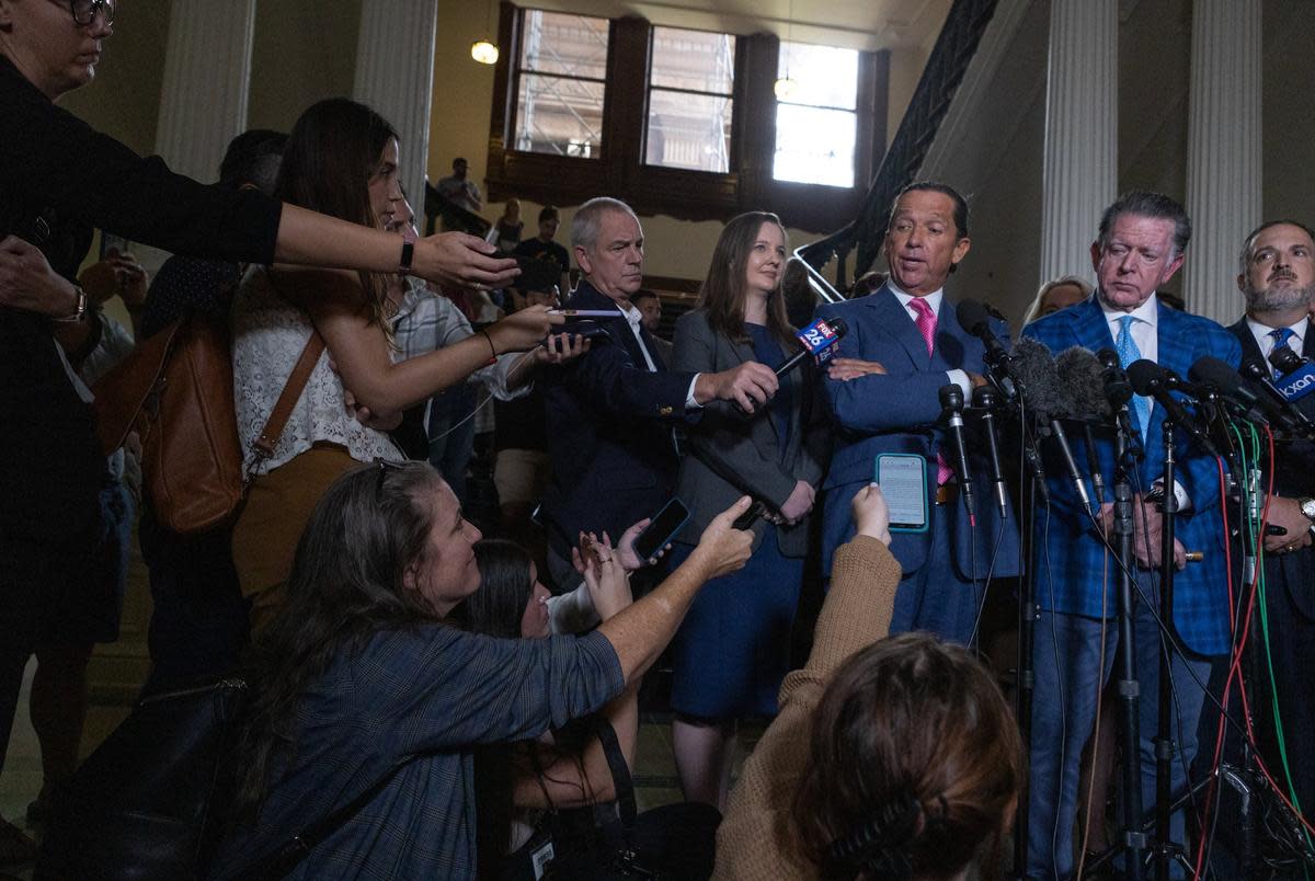 Ken Paxton’s defense attorney Tony Buzbee answers a question from Texas Tribune reporter Karen Brooks during a press conference following the Senate’s vote to acquit Attorney General Ken Paxton of 16 articles of impeachment on Sept. 16, 2023.