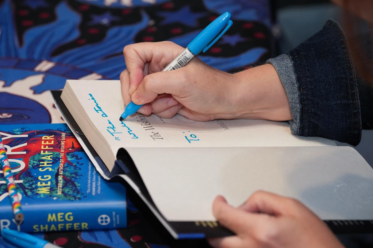 Meg Shaffer, a USA Today bestsellng author, signed copies of her second novel The Lost Story following a release party and book reading at the Carmichael's Bookstore in Louisville, Ky. on July 16, 2024. Shaffer lives in Kentucky.