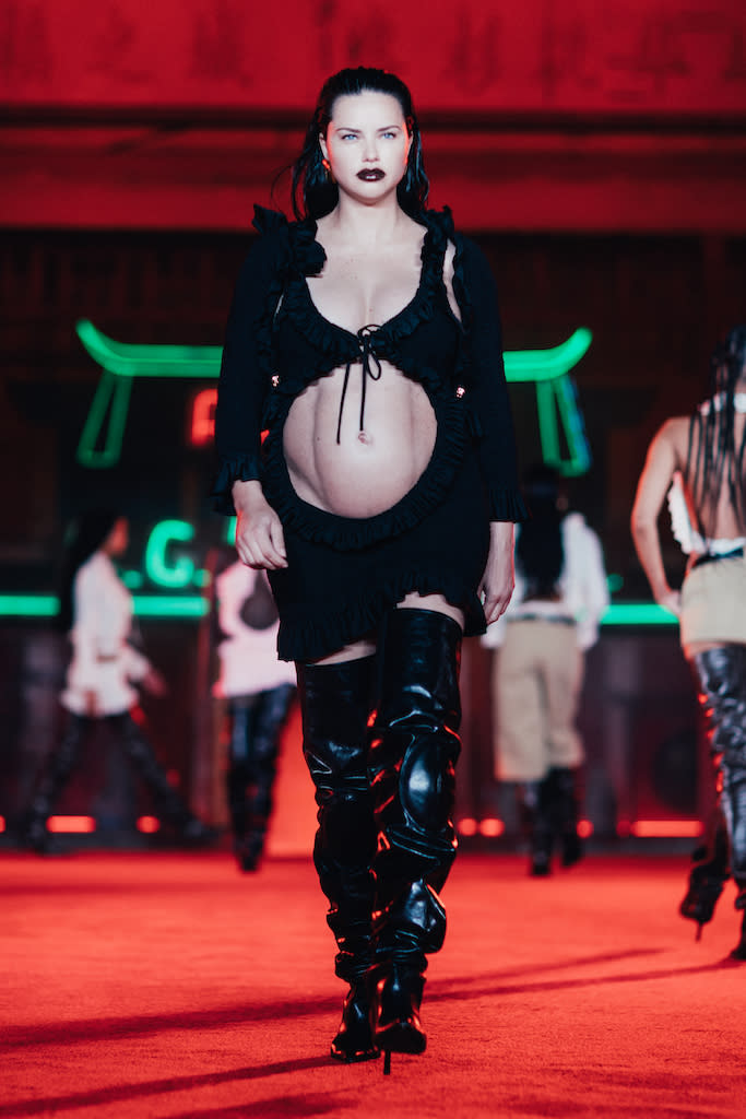 Pregnant Adriana Lima Cradles Her Baby Bump on the Runway in Cutout