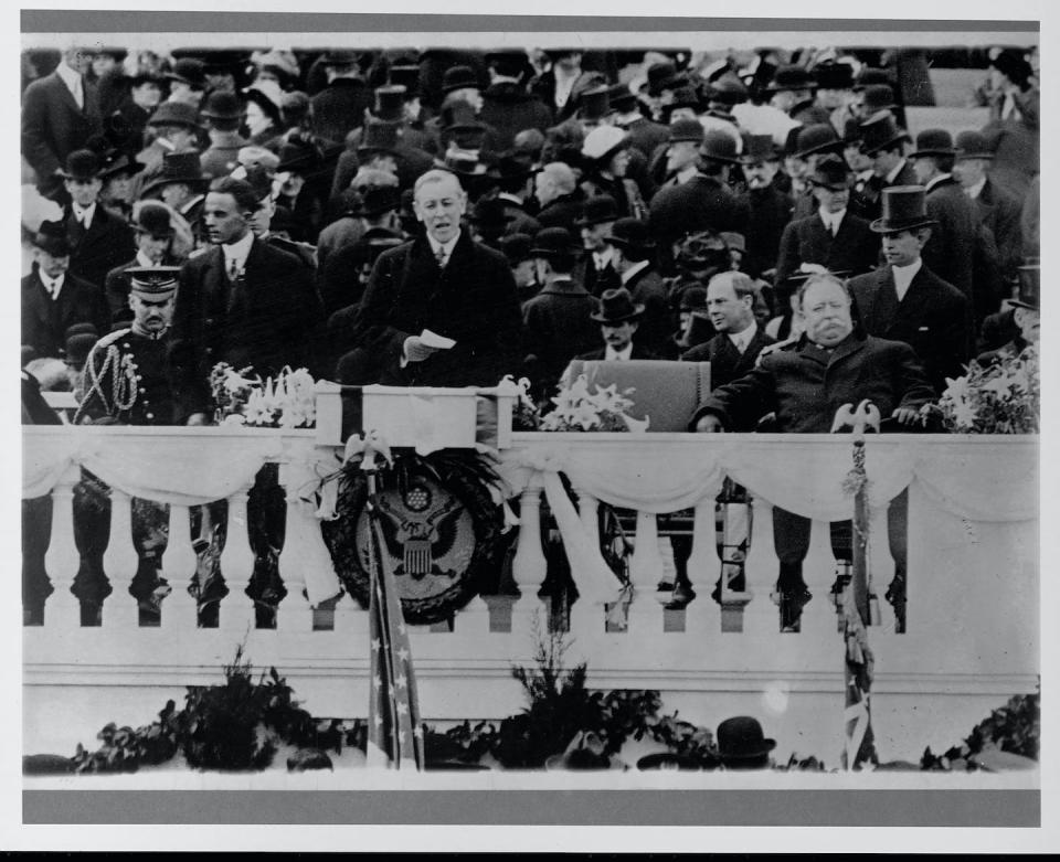 Woodrow Wilson speaks at his presidential inauguration in 1913. At right is outgoing president William Howard Taft. <a href="https://www.gettyimages.com/detail/news-photo/woodrow-wilson-speaking-at-his-inauguration-news-photo/640476559?phrase=president%20woodrow%20wilson&adppopup=true" rel="nofollow noopener" target="_blank" data-ylk="slk:Library of Congress/Corbis/VCG via Getty Images;elm:context_link;itc:0;sec:content-canvas" class="link ">Library of Congress/Corbis/VCG via Getty Images</a>