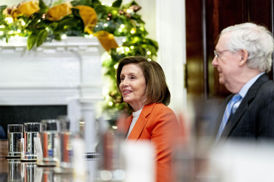 CORRECTS YEAR TO 2022 - House Speaker Nancy Pelosi of Calif., left, and Senate Minority Leader Mitch McConnell of Ky., right, attend a meeting with President Joe Biden and congressional leaders to discuss legislative priorities for the rest of the year, Tuesday, Nov. 29, 2022, in the Roosevelt Room of the White House in Washington. (AP Photo/Andrew Harnik)