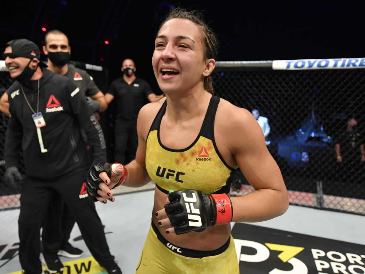 ABU DHABI, UNITED ARAB EMIRATES - JULY 12: In this handout image provided by UFC, Amanda Ribas of Brazil celebrates after her victory over Paige VanZant in their flyweight fight during the UFC 251 event at Flash Forum on UFC Fight Island on July 12, 2020 on Yas Island, Abu Dhabi, United Arab Emirates. (Photo by Jeff Bottari/Zuffa LLC via Getty Images)