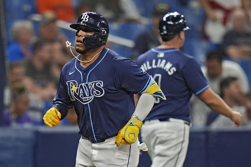 Tampa Bay Rays' Isaac Paredes, left, celebrates with third base coach Brady Williams after his two-run home run off Detroit Tigers relief pitcher Alex Faedo during the sixth inning of a baseball game Tuesday, April 23, 2024, in St. Petersburg, Fla. (AP Photo/Chris O'Meara)