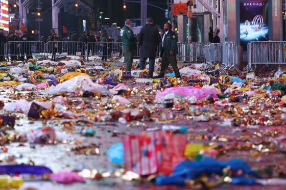 Confetti, hats, and rain ponchos littered the street on Jan. 1, 2023, following the Times Square ball drop to ring in the new year. <span class="copyright">YUKI IWAMURA—Getty Images</span>