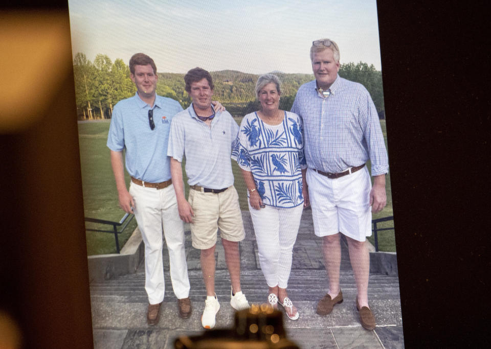 A family photo of Buster, Paul, Maggie and Alex is shown during the murder trial of Alex Murdaugh at the Colleton County Courthouse in Walterboro, S.C., on Thursday, March 2, 2023. / Credit: Andrew J. Whitaker/The Post And Courier via AP