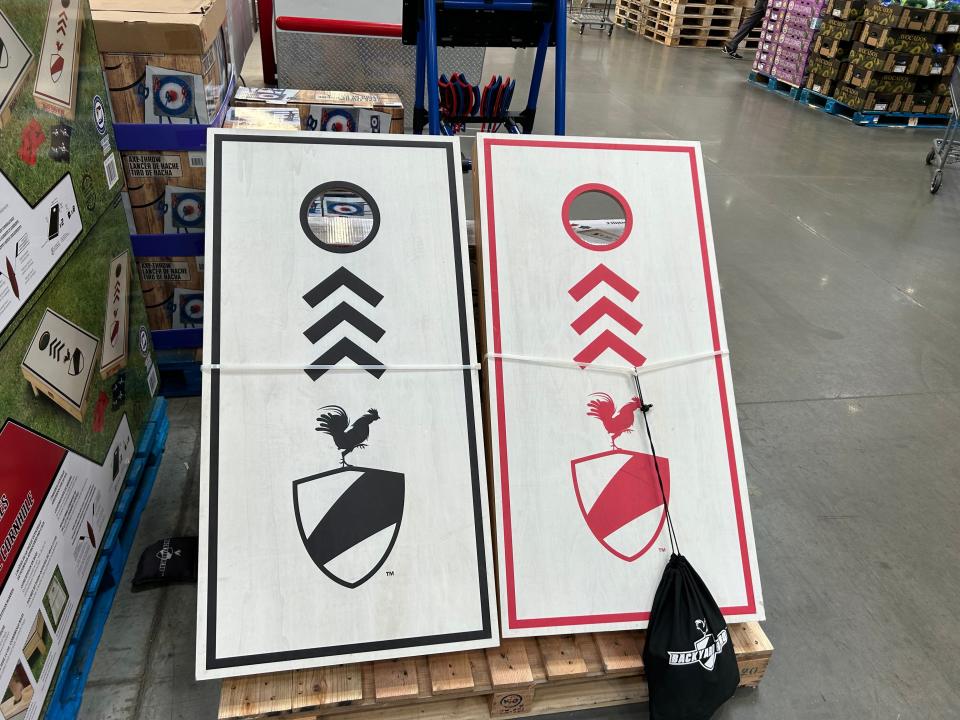 black and red corn hole game in a costco