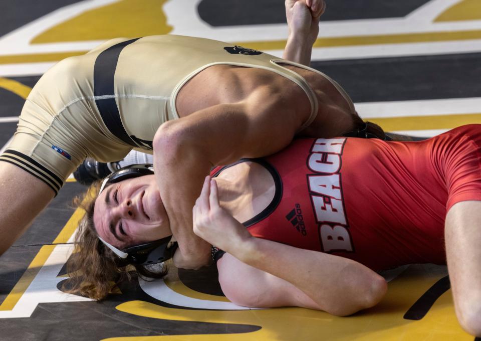 Point Pleasant Boro's Jack Thompson (left) pinned Point Pleasant Beach's Jack Schulter in 38 seconds Friday night in the 150-pound bout. Point Boro won the match 53-2.