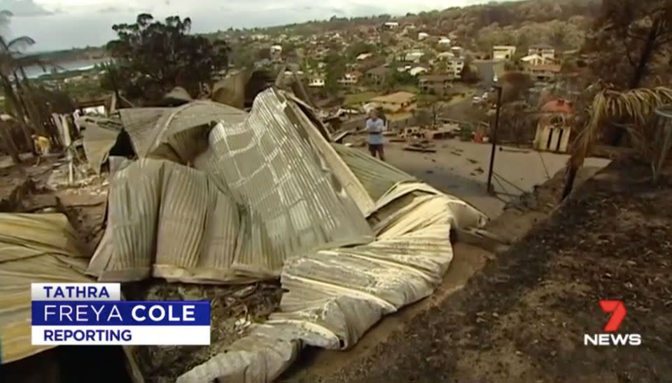 Mike Crowley surveys what's left of his Tathra home. Source: 7 News