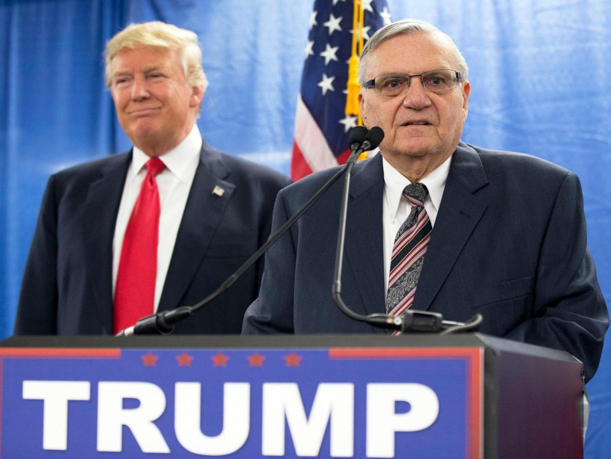 Then-candidate Donald Trump with then-Maricopa County Sheriff Joe Arpaio, on Jan. 26, 2016. Mr Trump has courted controversy for pardoning Mr Arpaio, a campaign ally: AP Photo/Mary Altaffer