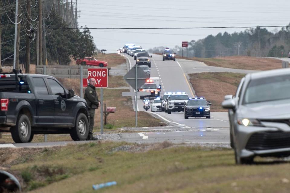 A procession escorting George County Sheriff’s officer Jeremy Malone, who was killed on Thursday, arrives at Moments Funeral Home in Lucedale on Friday, Jan. 5, 2024. Hannah Ruhoff/Sun Herald