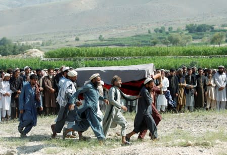 FILE PHOTO: Men carry a coffin of one of the victims after a drone strike, in Khogyani district of Nangarhar province, Afghanistan