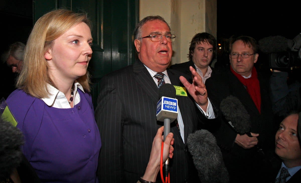 Conservative Party chair for South West Norfolk David Hills speaking to the media alongside Truss during her 2009 battle against deselection (Alamy)