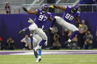 <p>Minnesota Vikings defensive end Danielle Hunter (99) celebrates with teammate Everson Griffen (97) after sacking Detroit Lions quarterback Matthew Stafford during the first half of an NFL football game, Sunday, Nov. 4, 2018, in Minneapolis. (AP Photo/Jim Mone) </p>