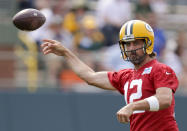 Green Bay Packers' quarterback Aaron Rodgers passes during NFL football training camp Wednesday, July 28, 2021, in Green Bay, Wis. (AP Photo/Matt Ludtke)