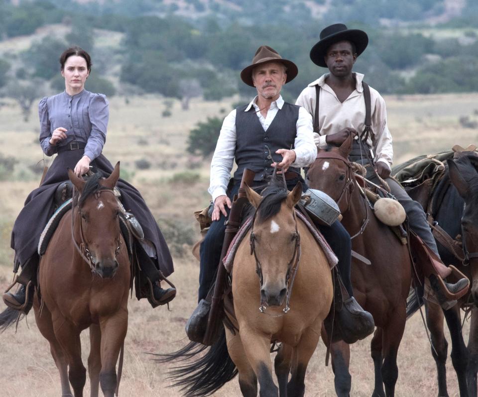 A bounty hunter (Christoph Waltz, center, with Warren Burke) is tasked with finding a woman (Rachel Brosnahan) south of the border in Walter Hill's Western "Dead for a Dollar."