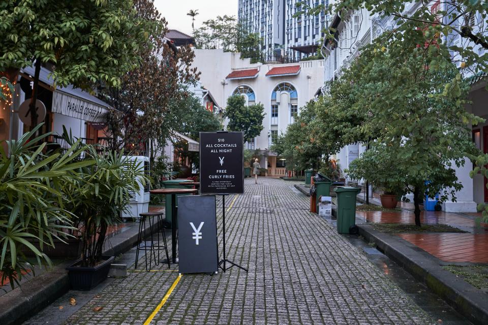 Bars, restaurants and streets empty in Singapore. Source: Bloomberg via Getty