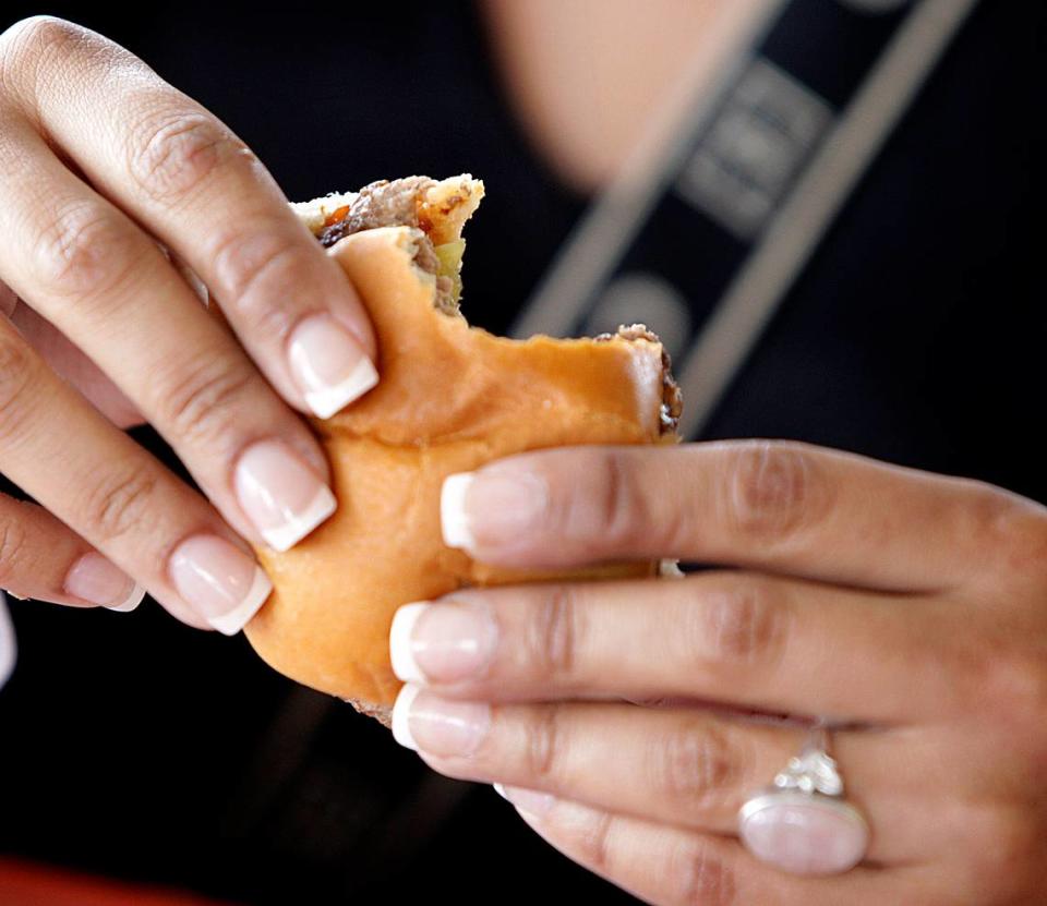 In 2008, a customer bites into one of those famous burgers at the last Royal Castle.