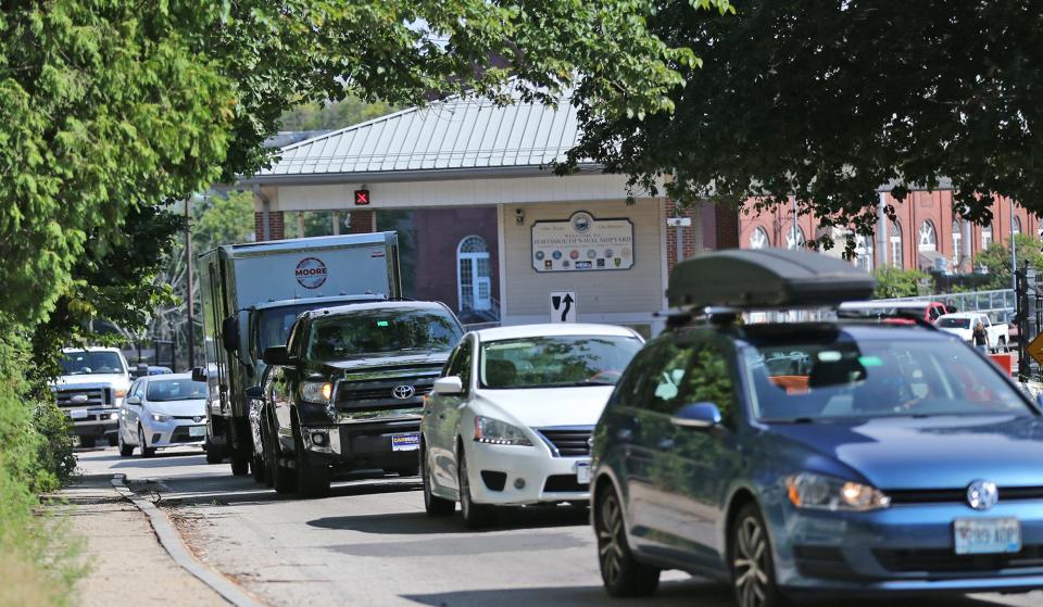 Portsmouth Naval Shipyard workers head home through Gate 1 in Kittery, Mane, creating a daily logjam of traffic departing the base on Seavey Island.