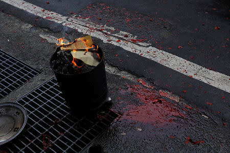 The blood of a pig pools on the ground during a sacrificial ceremony in Sanxia district, in New Taipei City, Taiwan February 1, 2017. REUTERS/Tyrone Siu