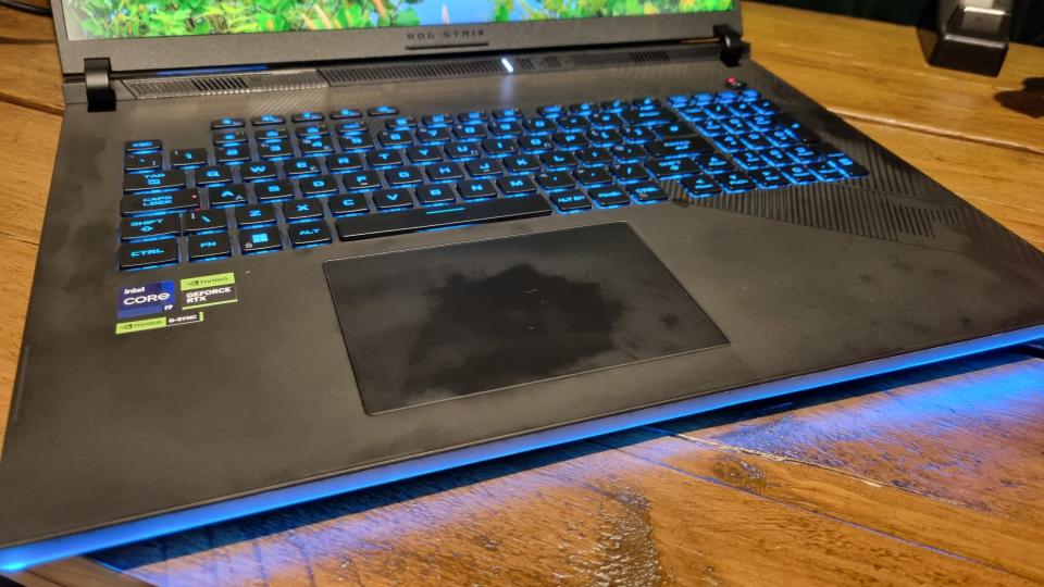 The Asus ROG Strix Scar 18 gaming laptop, covered in smudges and fingerprints from light usage