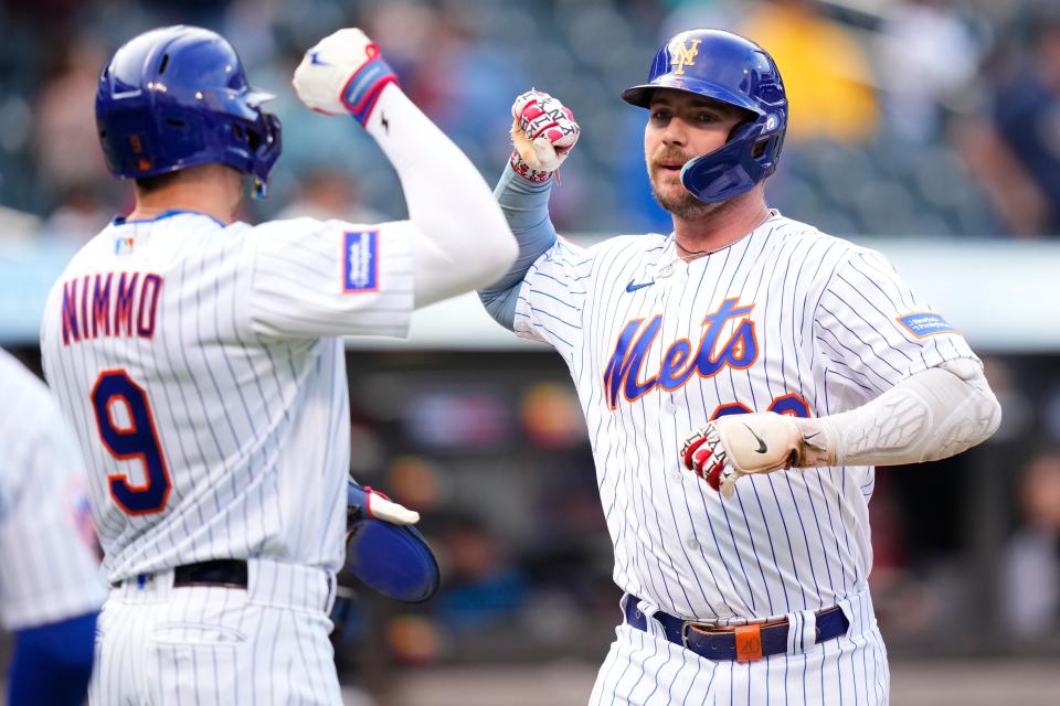 New York Mets' Pete Alonso (20) celebrates with teammatesm Brandon Nimmo (9) after hitting a two-run home run during the first inning in the first baseball game of a doubleheader against the Miami Marlins Wednesday, Sept. 27, 2023, in New York. (AP Photo/Frank Franklin II)