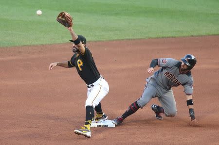 Jun 23, 2018; Pittsburgh, PA, USA; Arizona Diamondbacks pinch hitter Deven Marrero (10) reaches second base ahead of a throw to Pittsburgh Pirates second baseman Sean Rodriguez (3) during the ninth inning at PNC Park. Arizona won 7-2. Mandatory Credit: Charles LeClaire-USA TODAY Sports