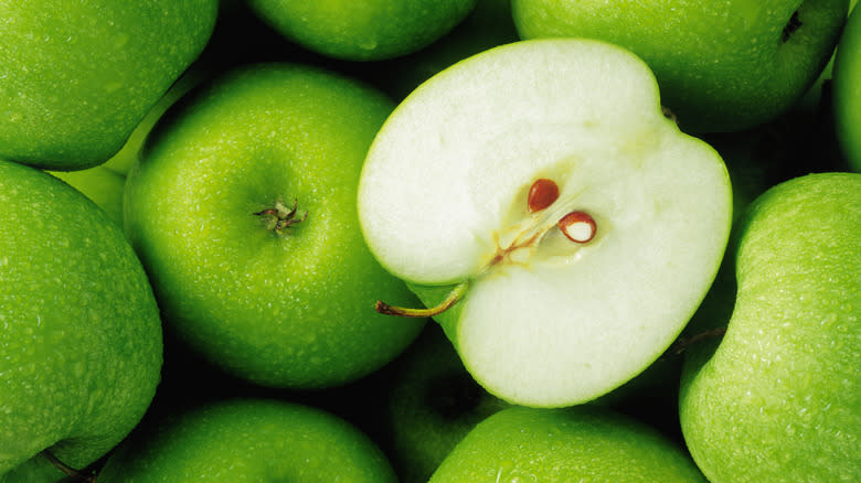 green apples and apple half