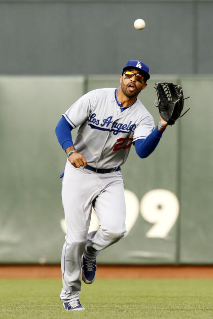 The Los Angeles Dodgers' Matt Kemp celebrates after his fifth