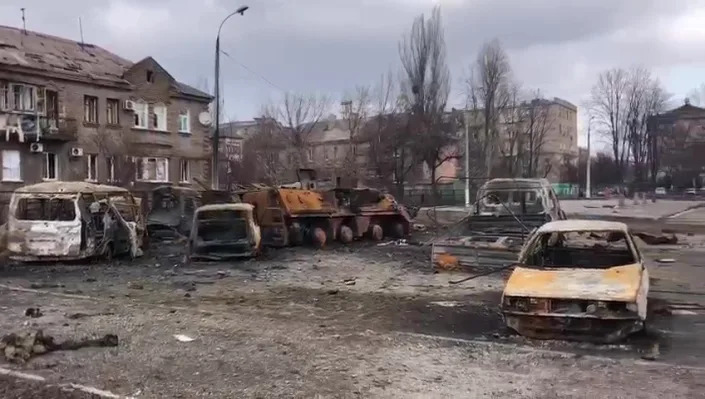 A screengrab captured from a video shows destroyed buildings and vehicles after Russian attacks in Mariupol, Ukraine, on March 21.