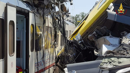 Two passenger trains are seen after a collision in the middle of an olive grove in the southern village of Corato, near Bari, Italy, in this handout picture released by Italian Firefighters July 12, 2016. Italian Firefighters/Handout via Reuters