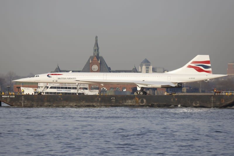 The British Airways Concorde moves up the Hudson River past Ellis Island on route to return to the Intrepid Museum on Thursday in New York. Photo by John Angelillo/UPI
