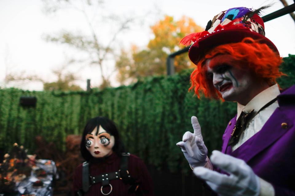 The Mad Hatter played by actor Bennie Ulin throws a tea party in the haunted house Malice in Wonderland at Adventureland Park for Phantom Fall Fest.