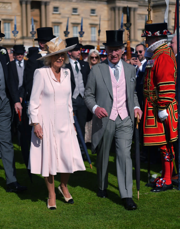 LONDON, ENGLAND - MAY 15: Queen Camilla and King Charles III during The Sovereign's Creative Industries Garden Party at Buckingham Palace on May 15, 2024, in London, England. Representatives across art, culture, heritage, TV, fashion and film attend the garden party hosted by the DCMS. <p>WPA Pool/Getty Images</p>