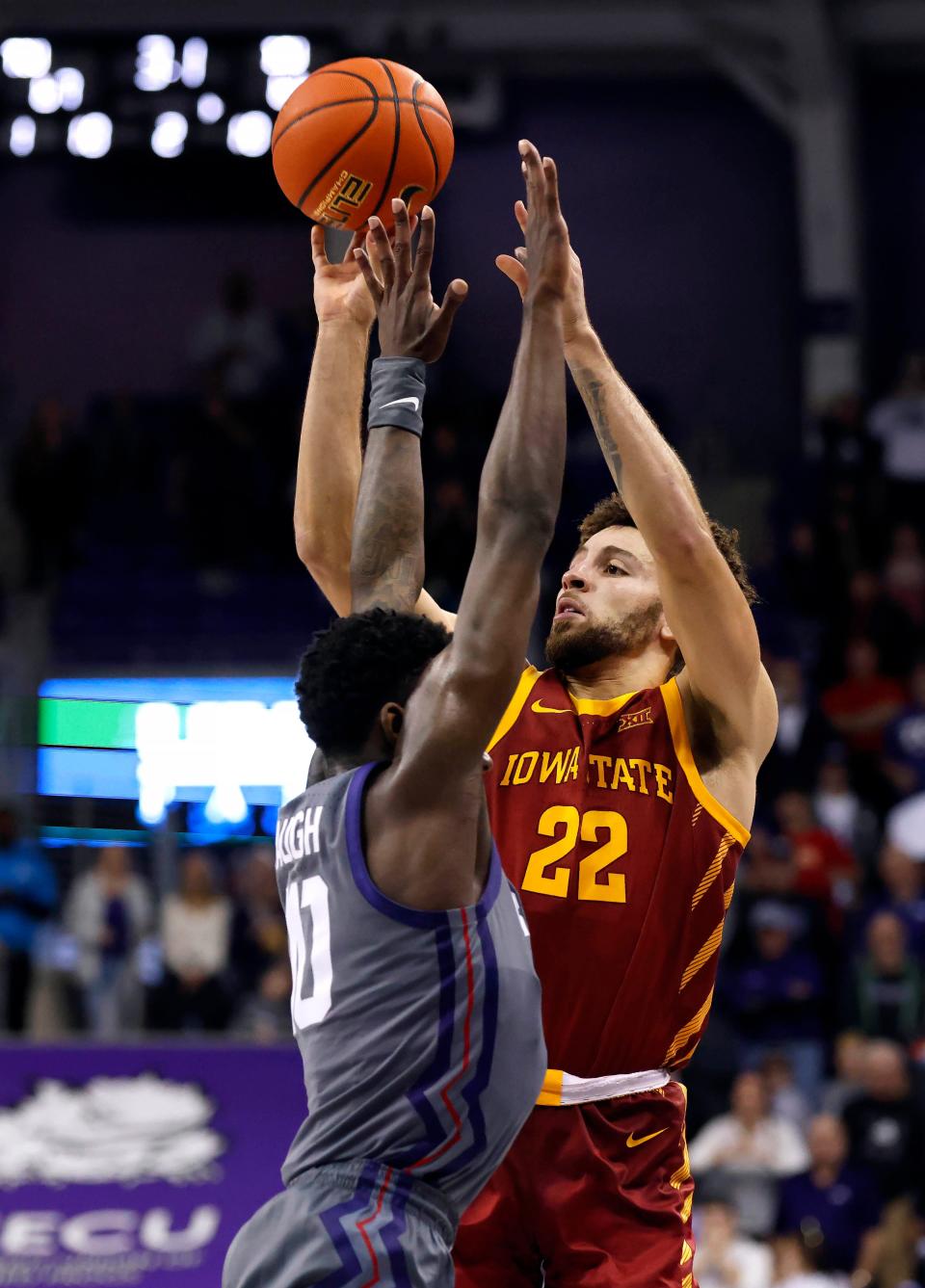 Iowa State guard Gabe Kalscheur (22) makes the game-winning shot over TCU guard Damion Baugh (10) on Saturday in Fort Worth, Texas. Iowa State won 69-67.